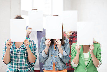 Image showing students covering faces with blank papers