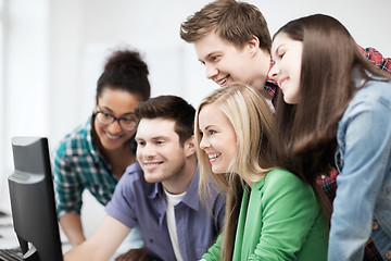 Image showing students looking at computer monitor at school