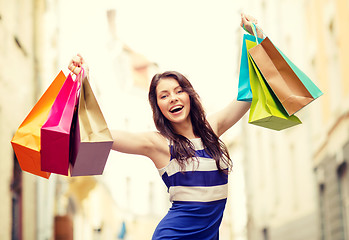 Image showing beautiful woman with shopping bags in the ctiy