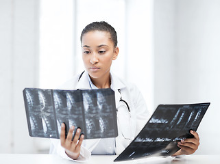 Image showing african doctor looking at x-rays