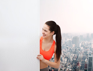 Image showing teenage girl in sportswear with white board