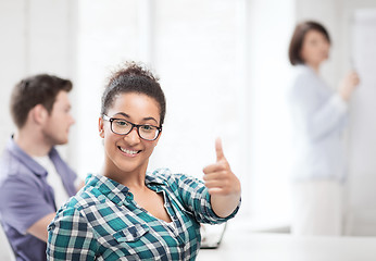 Image showing african student girl showing thumbs up