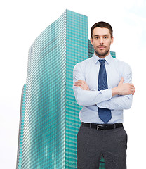 Image showing handsome businessman with crossed arms