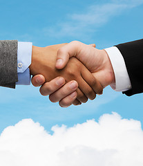 Image showing businessman and businesswoman shaking hands