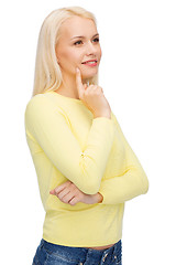 Image showing happy smiling woman dreaming