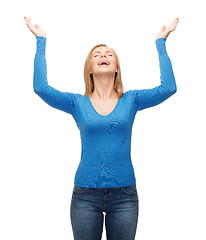 Image showing laughing young woman waving hands