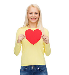 Image showing smiling woman with red heart