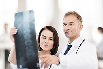 Image showing two doctors looking at x-ray