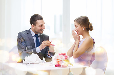 Image showing man proposing to his girlfriend at restaurant