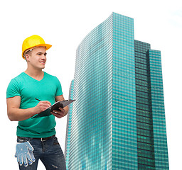 Image showing smiling man in helmet with clipboard