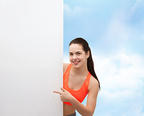 Image showing teenage girl in sportswear with white board