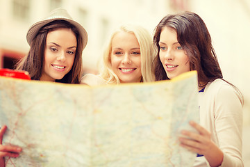 Image showing beautiful girls looking into tourist map in city