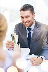 Image showing couple with glasses of champagne at restaurant