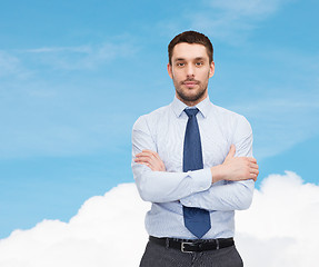 Image showing handsome businessman with crossed arms