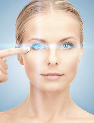 Image showing woman eye with laser correction frame