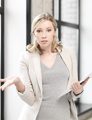 Image showing worried woman with documents