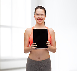 Image showing sporty woman with tablet pc blank screen