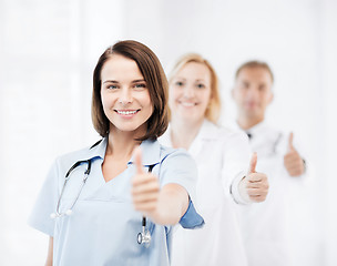 Image showing team of doctors showing thumbs up