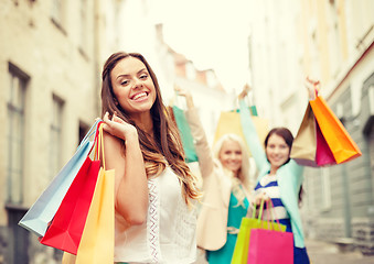 Image showing beautiful woman with shopping bags in the ctiy