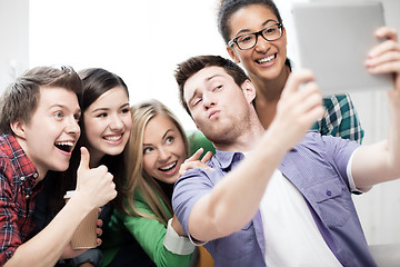 Image showing students making picture with tablet pc at school