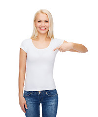 Image showing smiling young woman in blank white t-shirt