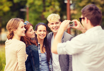 Image showing teenagers taking photo outside