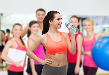 Image showing sporty woman with water bottle