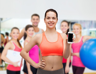 Image showing sporty woman with smartphone