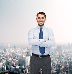 Image showing handsome businessman with crossed arms