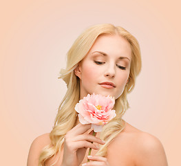 Image showing lovely woman with peony flower