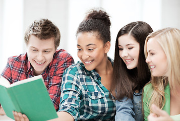 Image showing students reading book at school