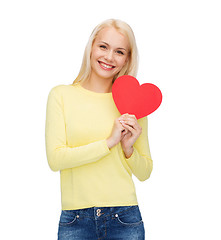 Image showing smiling woman with red heart