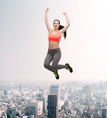 Image showing sporty teenage girl jumping in sportswear