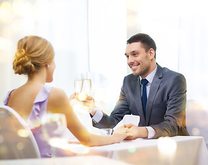 Image showing couple with glasses of champagne at restaurant