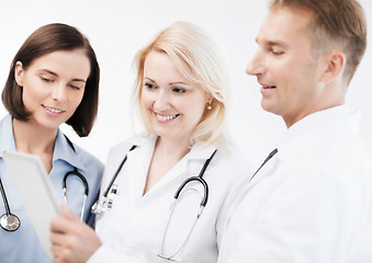 Image showing doctors looking at tablet pc