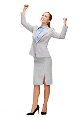 Image showing happy businesswoman with hands up