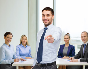 Image showing handsome businessman pointing finger at you