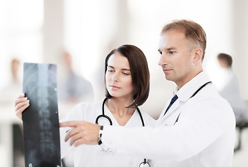 Image showing two doctors looking at x-ray