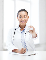 Image showing doctor with thermometer and stethoscope