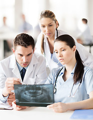 Image showing group of doctors looking at x-ray