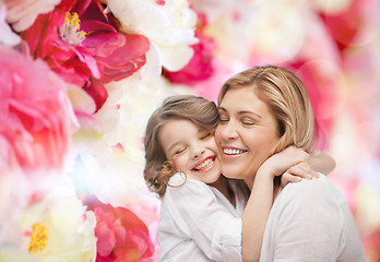 Image showing happy mother and daughter hugging