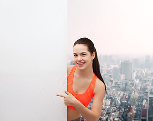 Image showing teenage girl in sportswear with white board