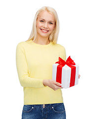 Image showing smiling girl with gift box