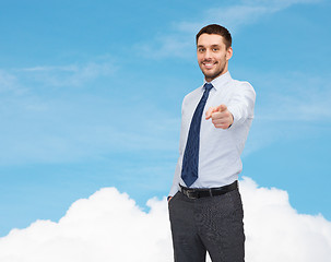 Image showing handsome businessman pointing finger at you