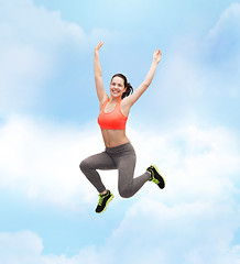 Image showing sporty teenage girl jumping in sportswear