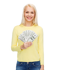 Image showing smiling girl with dollar cash money