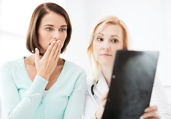 Image showing doctor with patients looking at x-ray