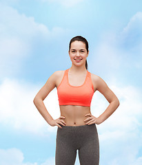 Image showing smiling teenage girl in sportswear