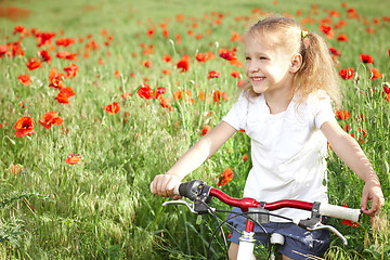 Image showing Happy smiling little girl with bicycle