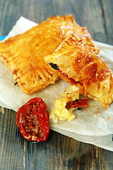 Image showing Puff pastry with cheese and sun-dried tomato.